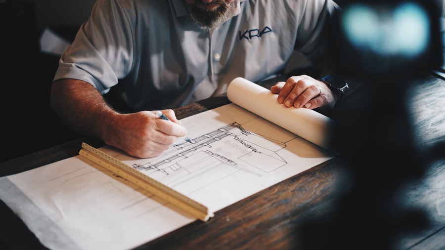 Architect reviewing custom home building plans on a desk